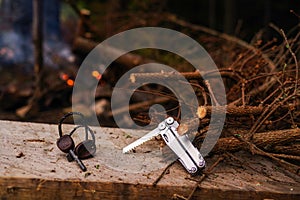Hiking tool. Pocket tool. Light a fire in the forest. Outdoors.