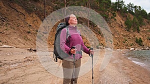 Hiking tourism adventure. Backpacker hiker woman looking at beautiful view. Hiker girl lady tourist with backpack