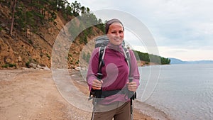 Hiking tourism adventure. Backpacker hiker woman looking at beautiful view. Hiker girl lady tourist with backpack