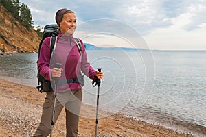 Hiking tourism adventure. Backpacker hiker woman looking at beautiful view. Hiker girl lady tourist with backpack