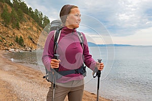 Hiking tourism adventure. Backpacker hiker woman looking at beautiful view. Hiker girl lady tourist with backpack