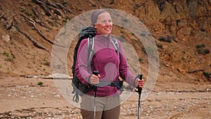 Hiking tourism adventure. Backpacker hiker woman looking at beautiful view. Hiker girl lady tourist with backpack