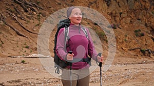 Hiking tourism adventure. Backpacker hiker woman looking at beautiful view. Hiker girl lady tourist with backpack