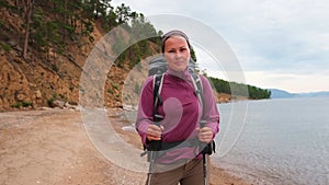 Hiking tourism adventure. Backpacker hiker woman looking at beautiful view. Hiker girl lady tourist with backpack