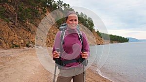 Hiking tourism adventure. Backpacker hiker woman looking at beautiful view. Hiker girl lady tourist with backpack