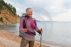 Hiking tourism adventure. Backpacker hiker woman looking at beautiful view. Hiker girl lady tourist with backpack