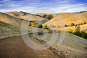 Hiking trail through golden hills at sunset in Garin Dry Creek Pioneer Regional Park photo