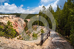 Hiking trail high above the colorful Grand Canyon of the Yellowstone