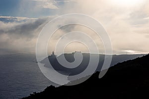 Hiking trail on Howth Island, Dublin, Ireland and Baily Lighthouse in silhouette