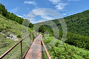 Hiking trail leading to Okatse Canyon in village Gordi, Imereti region, Georgia. Path surrounded by hills covered by