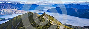 Hiking trail on mountain above lake landscape, scenic hike view over lake wanaka in new zealand, roys peak