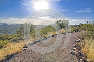 Hiking trail in the mountain overlooking scenic nature views on a sunny day