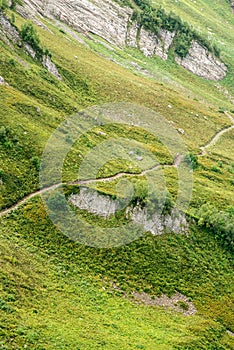 Hiking Trail in the Mountains. Aerial View. Green Alpine Meadows. Sochi. Russia