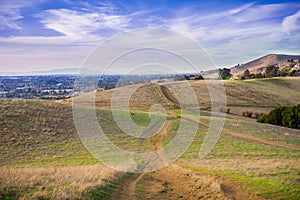 Hiking trail over the hills of Garin Dry Creek Pioneer Regional Park at sunset