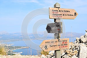 Hiking trail signs and Pollensa Bay near Alcudia on Mallorca photo