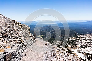Hiking trail to Lassen Peak; Lassen Volcanic National Park; Lake Almanor visible in the background; Northern California