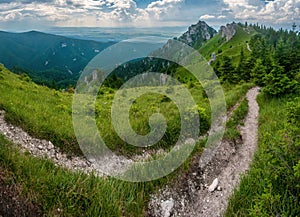 Hiking trail under rocks. Ostra peak in Big Fatra and Turiec basin, Slovak republic.