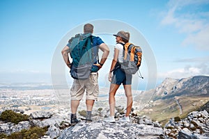 Hiking, view and couple in nature for fitness, travel and holiday in the mountains. Back of a training, walking and