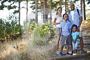 Hiking for the whole family. Portrait of an african american family enjoying a day out in the forest.