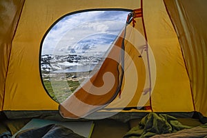 Hiking winter travel concept. View from tent - beautiful landscape of mountain nature