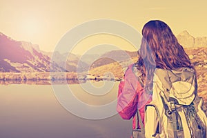 Hiking woman enjoying the Swiss alps landscape