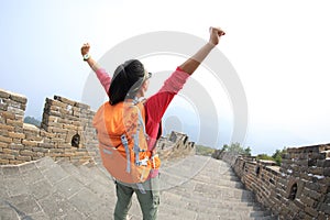 Hiking woman hiker open arms on chinese great wall