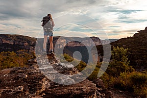 Hiking woman in mountain precipice with extraordinary views