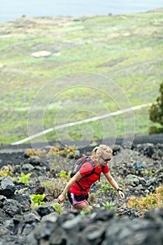 Hiking woman, runner in summer mountains