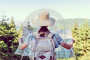 Hiking woman traveler with backpack