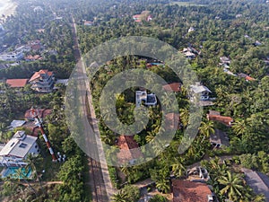 Hikkaduwa, Sri Lanka, 1.12.2020 - aerial view of railroads in tropical greenery