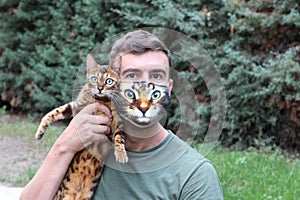 Hilarious man wearing his cat picture in protective face mask
