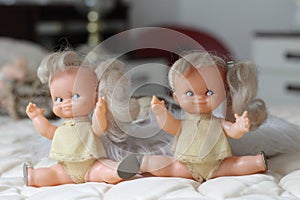 Hilarious twin dolls looking happy