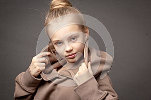 Hild-girl with long hair gathered in a bun