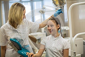 ÃÂ¡hild girl patient and woman dentist in dental clinic.