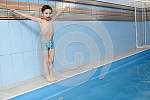 ï¿½hild jumping into swimming pool