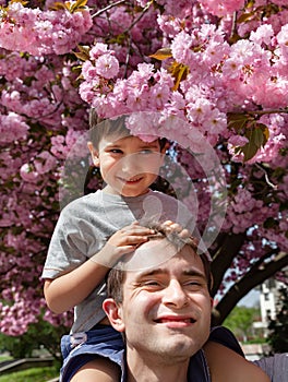 Ð¡hild playing with his father