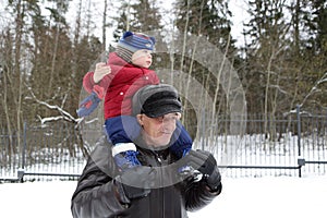 ï¿½hild on shoulders of his grandfather