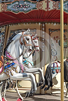 Ð¡hildren`s carousel with horses