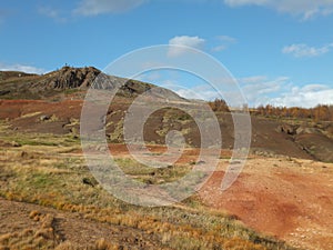 Hill above the Haukadalur Valley, geyser area in Iceland, colourful landscape