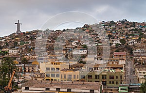 Hill covered by houses and Millennium Cross, Coquimbo, Chile