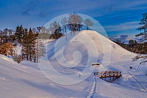 Hill Covered with Snow with Wooden Stairs