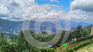 Hill and green trees under thick clouds somewhere in Letefoho, Timor-Leste.