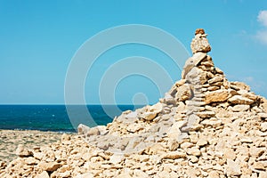 Hill of large stones on the beach, a mound