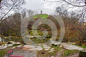 Hill near stone granite canyon of river Uzh in park with monuments to heroes and personalities of ancient Kievan Rus and ancient D