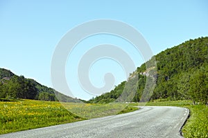 Hill, road trip and natural landscape with field, holiday or green scenery in countryside. Nature, relax and highway for