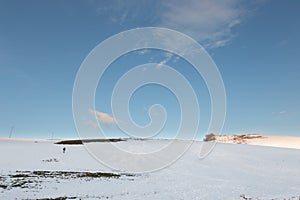 Hill, snow and man photo