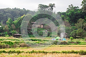 Hill tribe village And smoke rising from the cooking.