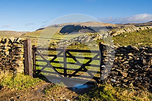 Hill walking the Norber Eratics around Austwick in Craven in  the Yorkshire Dales photo