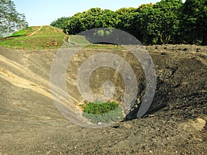 The bomb crater at A1 Hill in Dien Bien Phu, VIETNAM, which was an important battlefield during the Battle of Dien Bien Phu photo