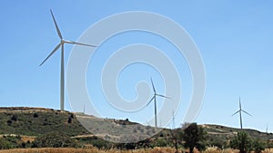 Hill with windmills in Larnaca, Cyprus. Renewable energy resource of alternative energy production